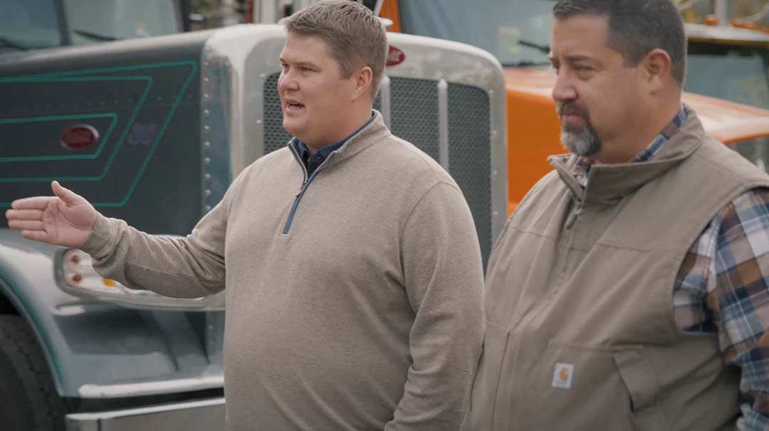 Logan Haugen reviewing operations on-site with a client